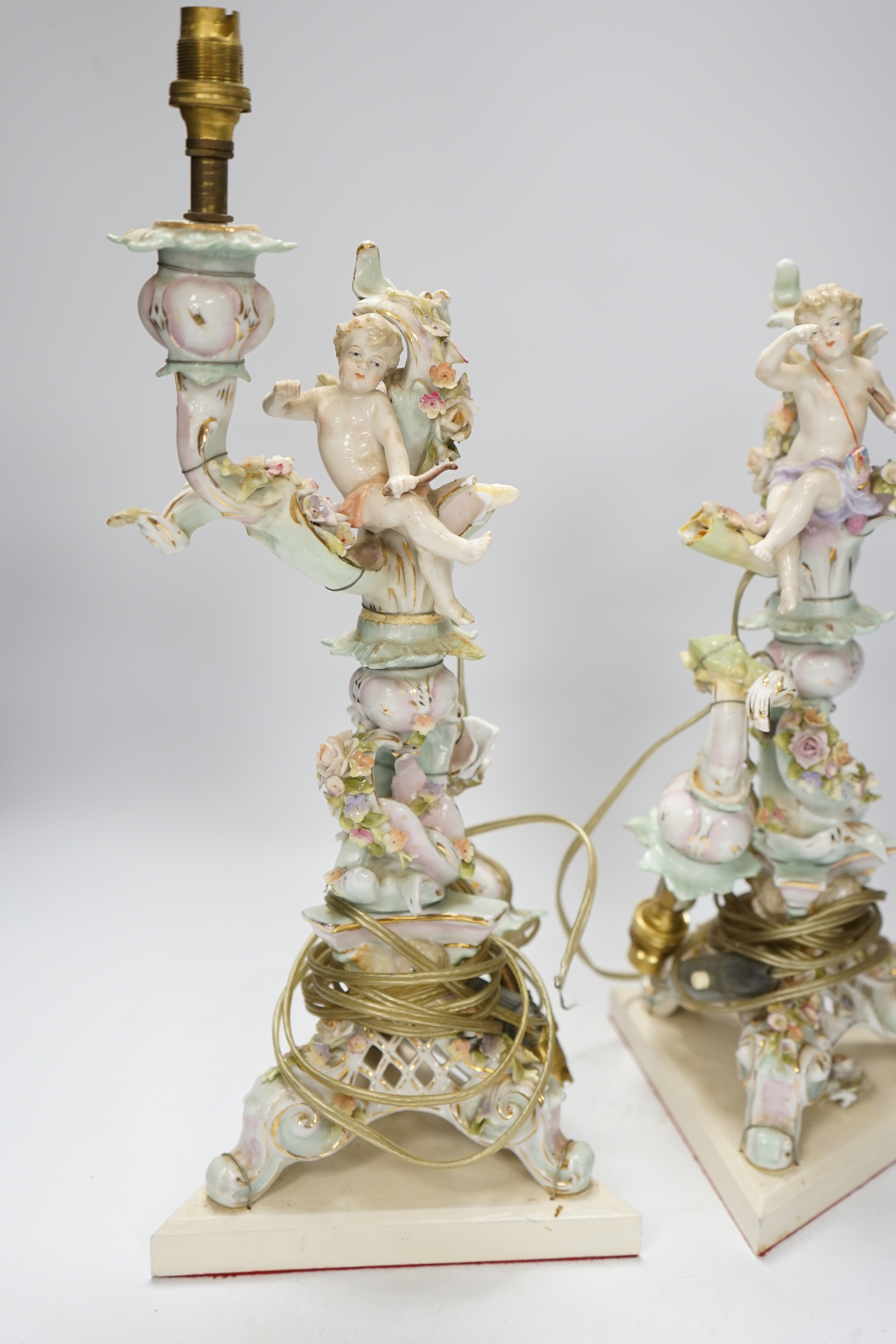 A pair of Sitzendorf floral encrusted porcelain table lamps, 42cm total